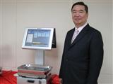 AdvanPOS founder Morris Hsu and a PC-based electronic scale POS