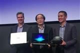 Asustek vice president Eric Chen (center) presents new products