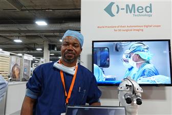 i-Med Technology CEO Vincent Graham and 3D digital surgical head-mounted loupe (at his left)