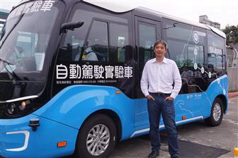 Kingwaytek Technology president San Huang and the autonomous vehicle under test