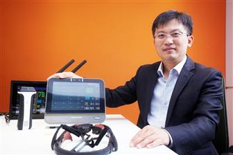 Broadsims CEO Bruce Yu with a patient monitor